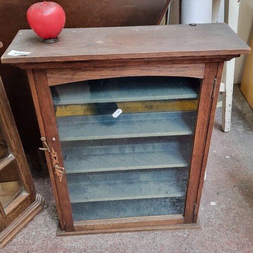 1000 - A very nice glass door wall mounted collectors cabinet. With Key.