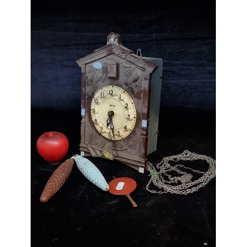 202 - A vintage German made Wiltic cuckoo clock with weights and pendulum. Needs a wipe but nice piece.