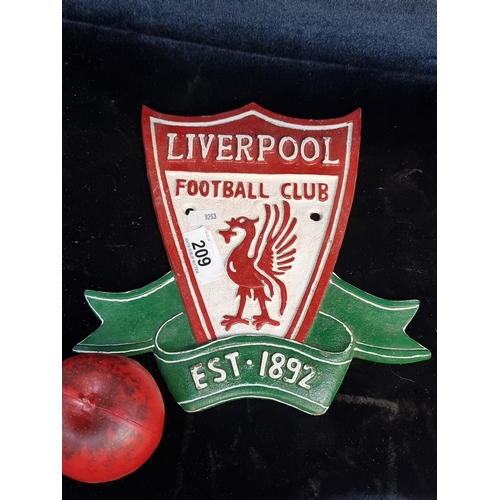 209 - A heavy cast metal wall plaque in the form of the Liverpool football club crest.