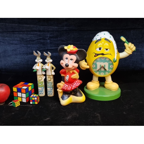 217 - Great retro items including two Bugs Bunny spin pop candy dispensers, an M&Ms desk clock and a Minni... 