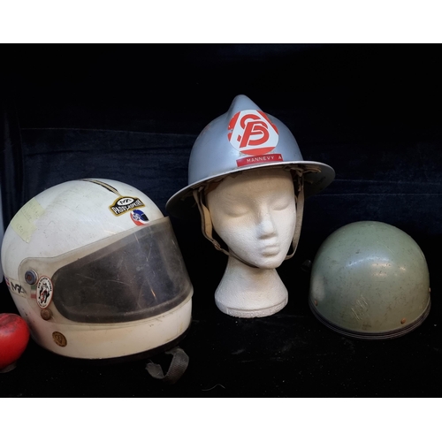 225 - Three cool vintage helmets including a French firefighter helmet, along with two motorcycle helmets,... 