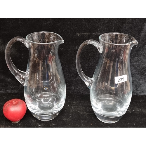 229 - Two fabulous vintage large class water pitchers.