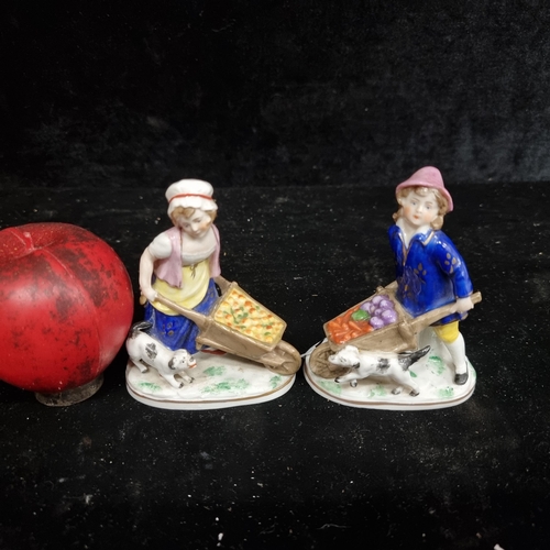 257 - Two vintage hand-painted miniature Capodimonte figurines. Of you young girls with wheel barrows full... 