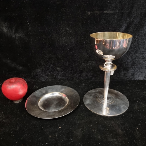 259 - Two ecclesiastical themed items including a eucharist plate and a chalice with the inscription 'Pres... 