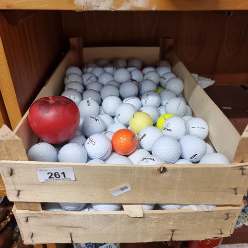 261 - A crate containing a huge collection of golf balls including brands such as Titleist, TaylorMade and... 