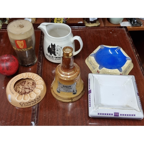 263 - Six wonderful pieces of breweriana including an Arklow pottery Guinness ashtray, a bells whiskey dec... 