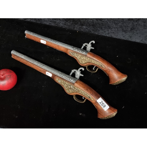 269 - Two handsome replicas of blunderbuss dueling pistols.