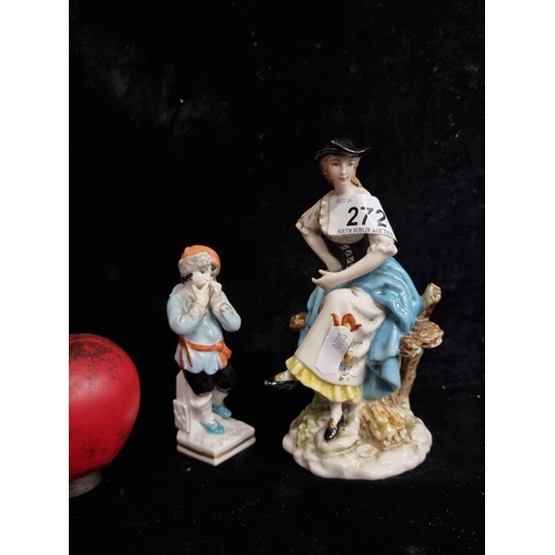 272 - Two pretty porcelain figures including a 19th century German young lady perched on a bench, along wi... 