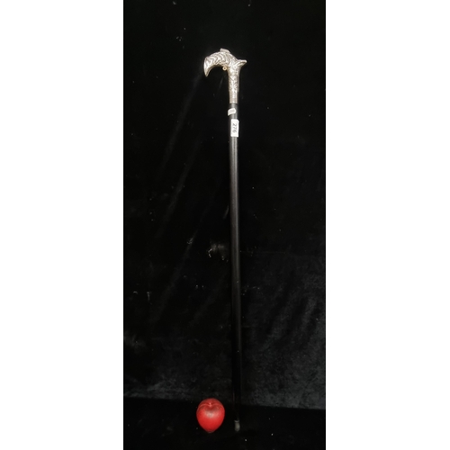 276 - A stylish well made ebonized wood gentleman's walking stick featuring a silver plated highly detaile... 