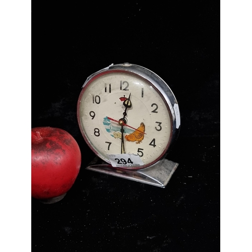 294 - A super sweet retro chrome alarm clock with animated pecking hen to face. The Hen pecks to the secon... 