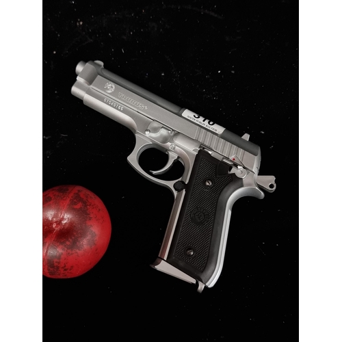 310 - A Taurus PT 92 spring loaded BB pistol, Less than 1 joule. Heavy with a full clip.