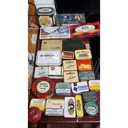 313 - A box containing a large number of assorted vintage tins including cigarette / tobacco examples by b... 