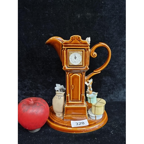 320 - A fabulous Park Rose porcelain grandfather clock pitcher featuring a charming narrative of a cat and... 