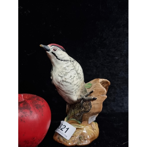 321 - A lovely Beswick porcelain figure of a Lesser Spotted Woodpecker, in a colourful glaze. In very good... 