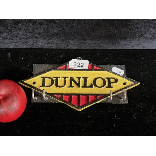 322 - A cast metal key rack with four hooks, showing the Dunlop logo.