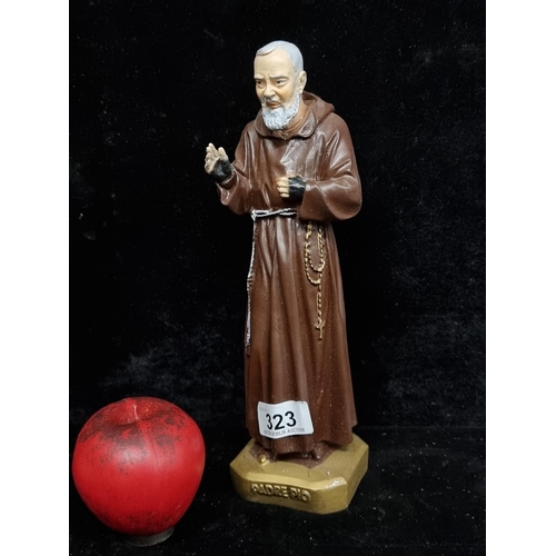 323 - A figural sculpture of Padre Pio in a hand painted finish.