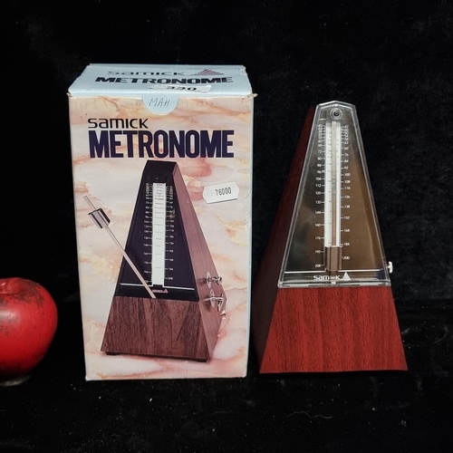 330 - A Samick branded metronome with bell, held in original box.