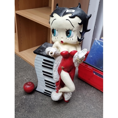 336 - A quirky retro shelving unit / CD rack in the form of a wavy piano, featuring Betty Boop to side. mi... 