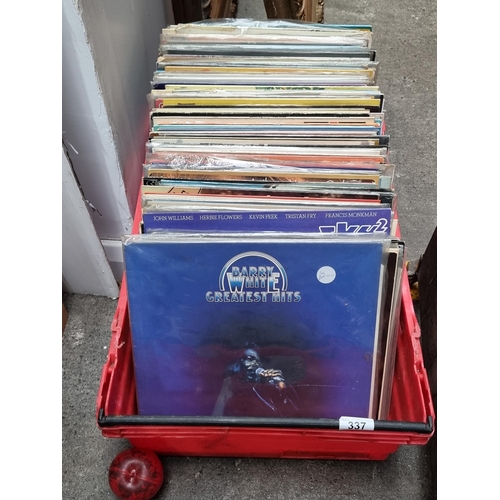 337 - A crate filled with a large number of vintage vinyl records including examples by Barry White, Eric ... 