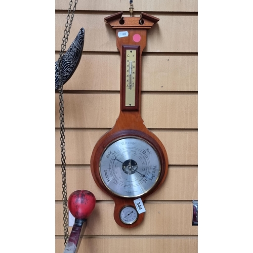 344 - A handsome vintage banjo barometer housed in a hand carved wooden case.