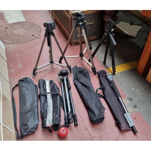 380 - Four handy camera tripod stands with adjustable height. Includes three carry cases and a Libec MP-66... 