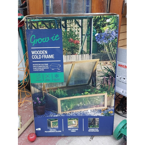 394 - A brand new unused wooden garden cold frame with polycarbonate glazing. Original price tag of €89.95... 