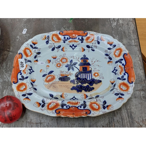 409 - An early 19th century Stone China Imari pattern serving platter.