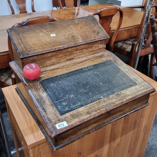 872 - Star Lot: A 19th century desk top writing slope with tooled leather top and two compartments that li... 