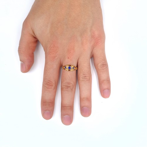 51 - Star Lot : A nice example of an antique 18K gold,  ring set with sapphires and diamond accents, ring... 