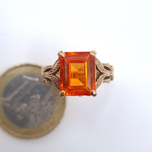 58 - Star Lot : A heavy vintage  orange topaz stone ring with attractive foliate mount set in 10K gold, h... 