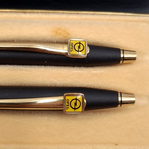 587 - A cross pen set consisting of a ball point and propelling pencil, in classic black with opel car ins... 