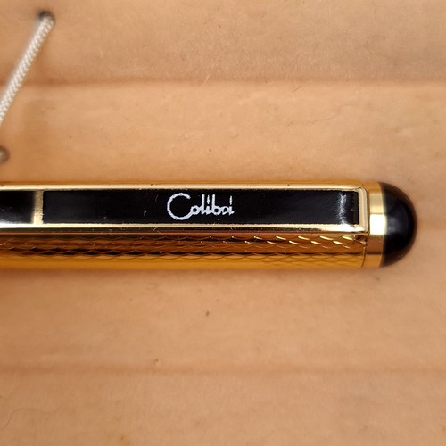 588 - A calibri ballpoint pen with gold tone finish in original box.