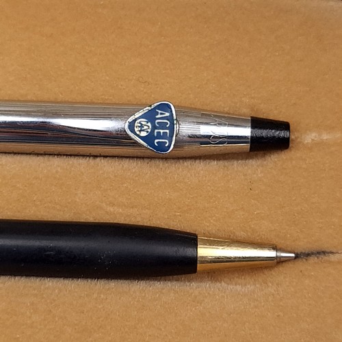 592 - A box containing two cross ballpoint pens, one with insignia also three brushed satin ballpoints, an... 