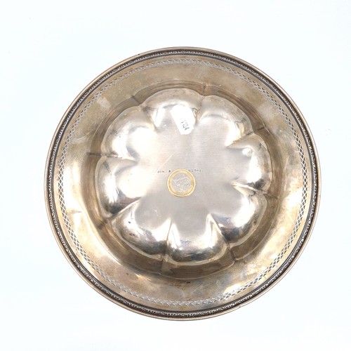 594 - Star Lot : A hallmarked sterling silver dish with lattice and foliate rim, 26cm diameter, weight 314... 