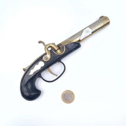 596 - A heavy reproduction antique flint lock pistol, length 20cm, weight 292 grams.