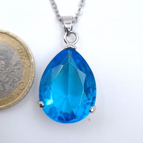 599 - A sterling silver blue stone pendant necklace, length of chain 46cm, together with a multi stone pen... 