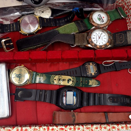 613 - A collection of assorted wristwatches together with a machine cut cigarette case. With vintage examp... 