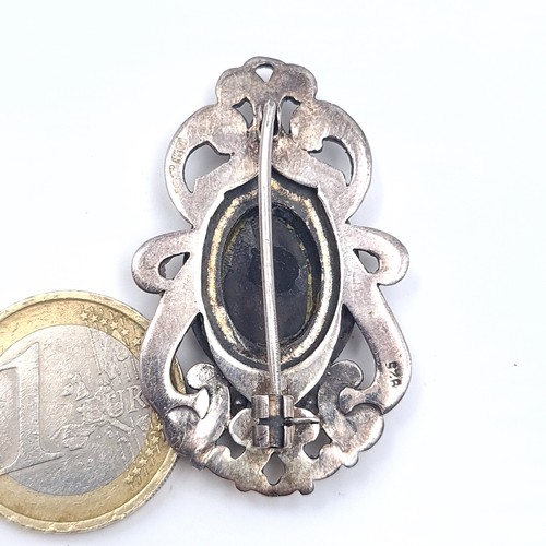 619 - A pretty vintage onyx brooch with marcasite foliate design set in sterling silver, weight 11.87 gram... 