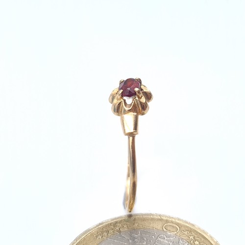 636 - A 9K gold garnet stone ring, size N, weight 0.9 grams, boxed.