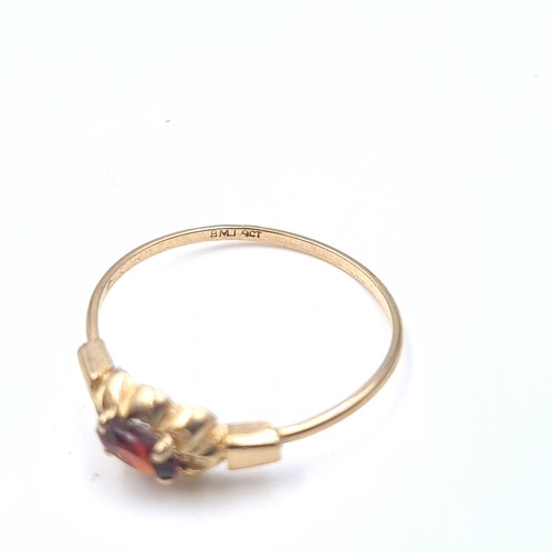 636 - A 9K gold garnet stone ring, size N, weight 0.9 grams, boxed.