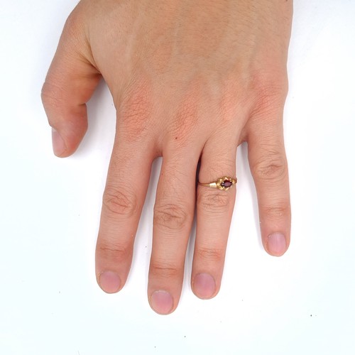 636 - A 9K gold garnet stone ring, size N, weight 0.9 grams, boxed.