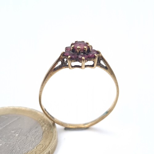 637 - A 9K gold garnet cluster ring, ring size N, weight 1.15 grams.