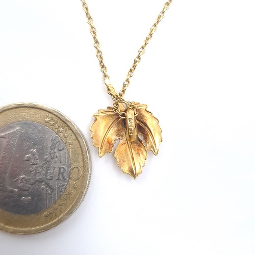 647 - A 9K gold leaf design pendant necklace with chain, length 38cm, weigh 1.95 grams, boxed.