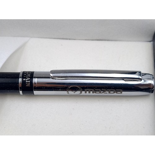 658 - A Balmain of Paris boxed ballpoint pen in unused condition set with Mazda insignia.