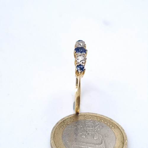 667 - Star Lot : A fine 9K gold five stone diamond and sapphire eternity ring, size O, weight 2.8 grams, b... 