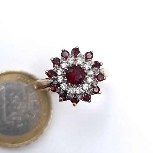 668 - A vintage 9K gold garnet and gemstone cluster ring hallmarked Birmingham, size R, weight 3.6 grams, ... 