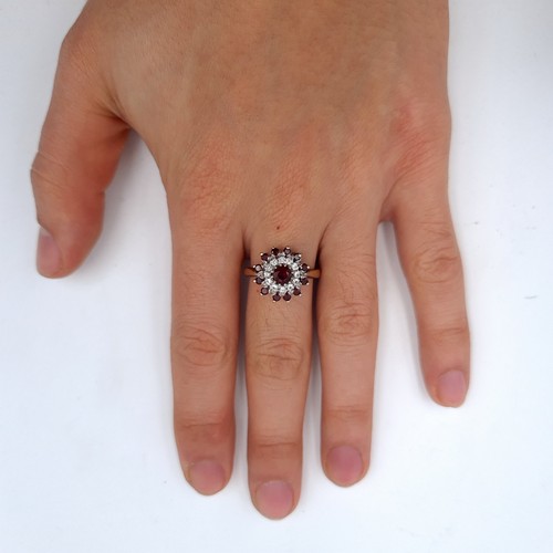 668 - A vintage 9K gold garnet and gemstone cluster ring hallmarked Birmingham, size R, weight 3.6 grams, ... 