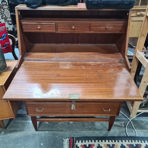 751 - Star Let : A super mid century writing bureau, with three drawers and fitted interior.  Info vendor ... 