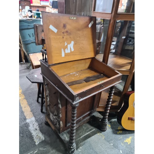 738 - An antique 19th century writing desk / bureau with spindle gallery back, leather writing slop which ... 