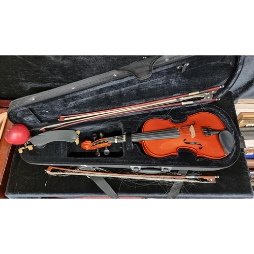 146 - A Marcato violin in original case with three bows and chin rest in excellent condition.